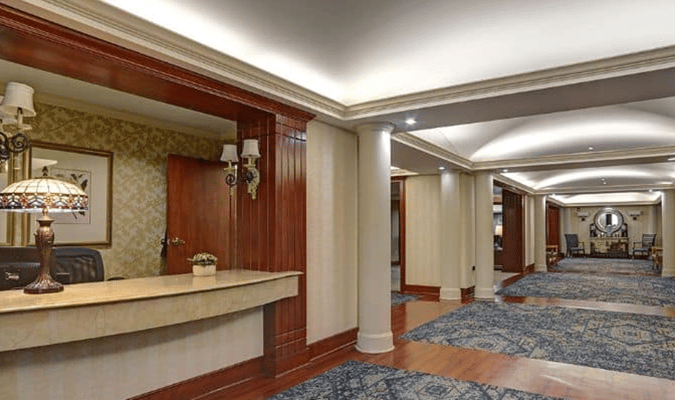 Interior view of a lobby area with a reception desk