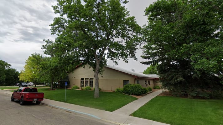 View of the exterior of Nano Nagle Village surrounded by trees.