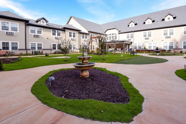 Well-maintained outdoor garden area with seating and landscaping