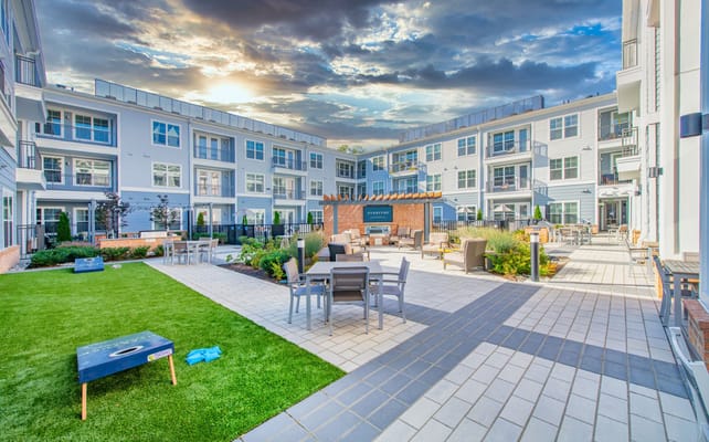 Outdoor courtyard with seating and greenery