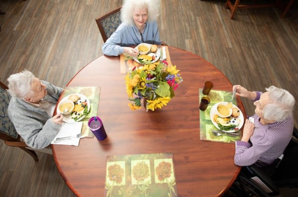 Residents enjoying a meal in a dining room