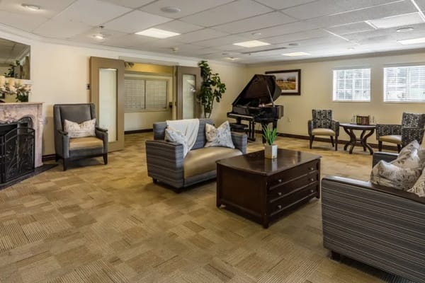 Interior common area with seating and a piano