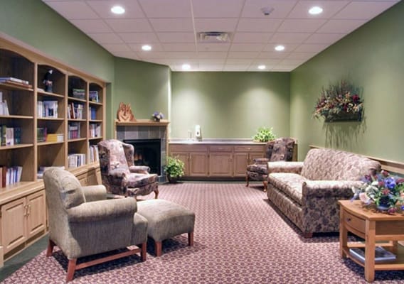 Cozy common area with comfortable seating and bookshelves