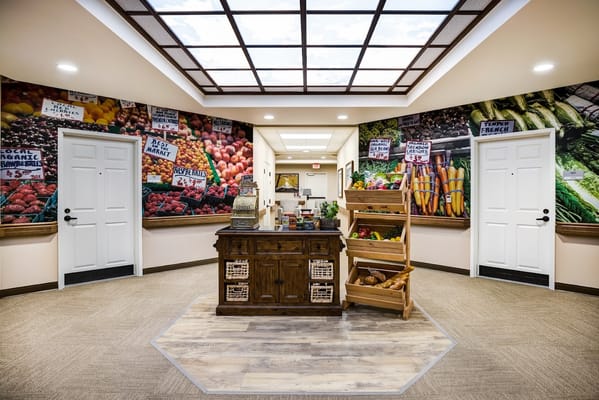 A warm and inviting common area with food-themed mural