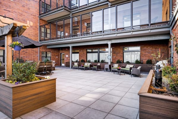 Patio area with seating and planters