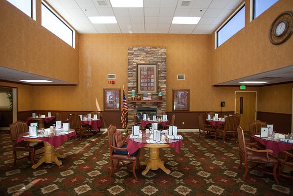Dining room with tables and decor in a senior facility