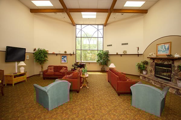 Cozy common area with seating and fireplace
