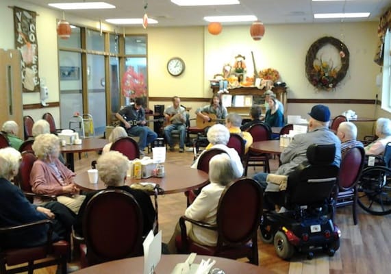 Residents enjoying live music in a common area