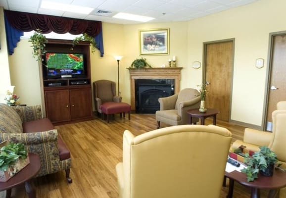 Common area with comfortable seating and a fireplace
