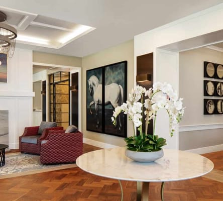 Warm living room with comfortable seating and decorative art.