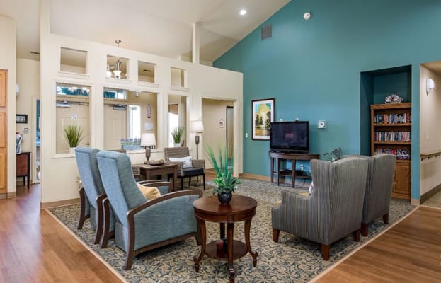 Interior common area with seating and bookshelves