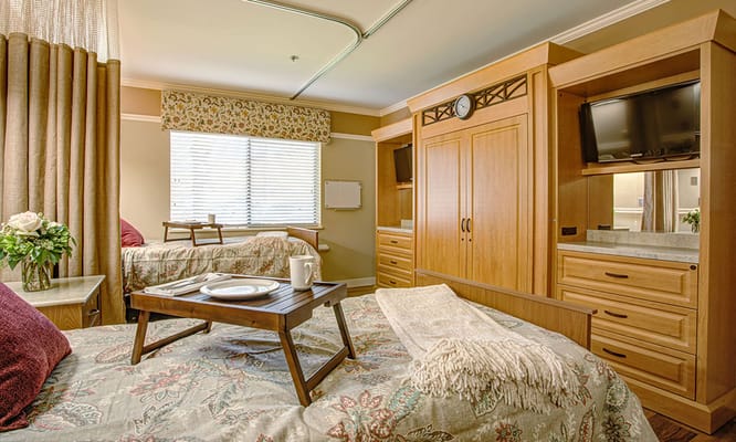 Cozy resident room with two beds and amenities