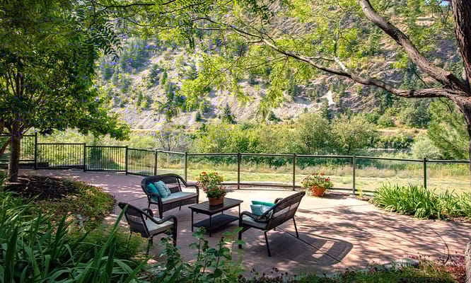 Outdoor seating area with scenic view and flowers