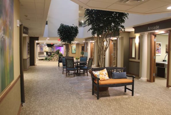 Cozy lobby with seating and greenery at Robinwood Retirement Resort.