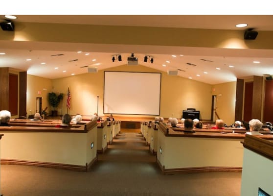 Interior view of the theater room with residents seated