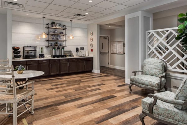 Cozy coffee area with seating and storage shelves