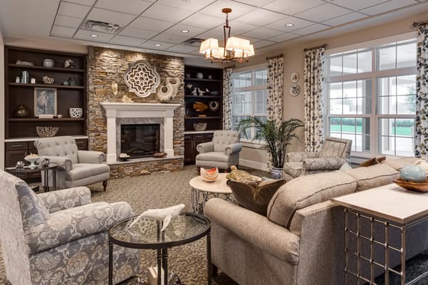Warm and inviting living room with fireplace and comfortable seating.