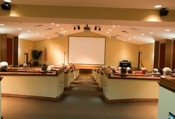Residents watching a movie in a theater room