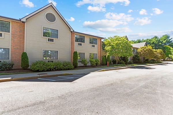 Exterior shot of Smithfield Woods building with landscaping