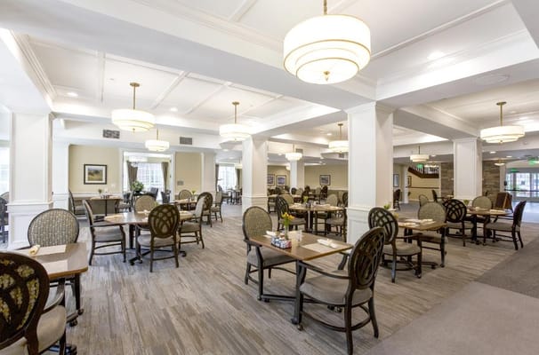 Spacious dining room with tables and chairs
