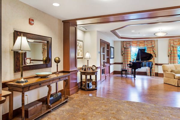 Interior view of the lobby featuring a grand piano and decorative furnishings.