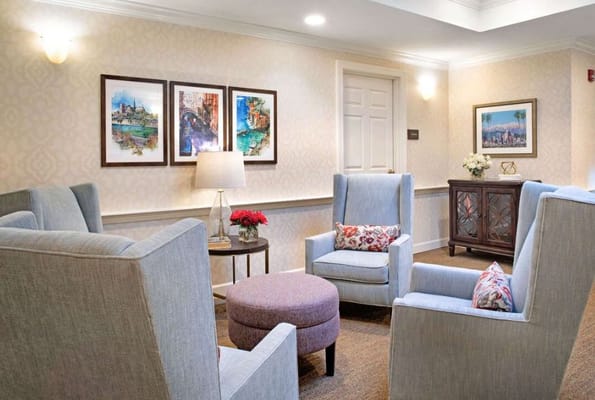 Cozy sitting area with comfortable chairs and artwork