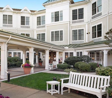 Exterior view of the facility entrance with seating area