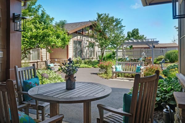 Outdoor patio area with seating and garden