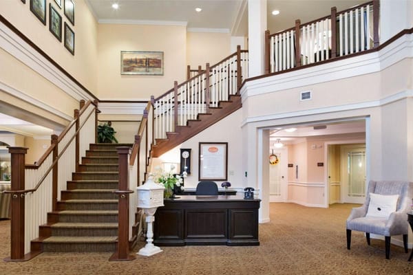 Facility lobby with a staircase and reception area