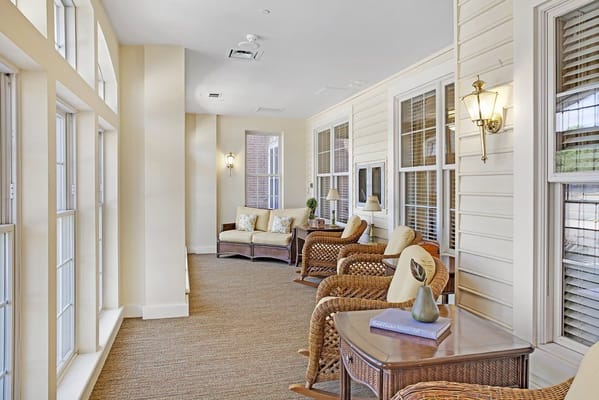 Comfortable seating area with natural light in a senior living facility.