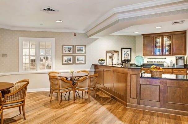 Bright dining area with wooden furniture and a coffee station