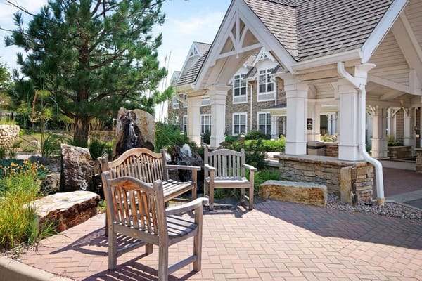 Wooden benches in a landscaped outdoor area