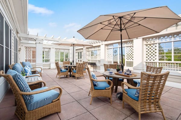 Outdoor seating area with umbrellas and chairs