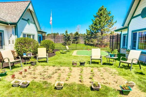 Bright garden space with potted plants and seating