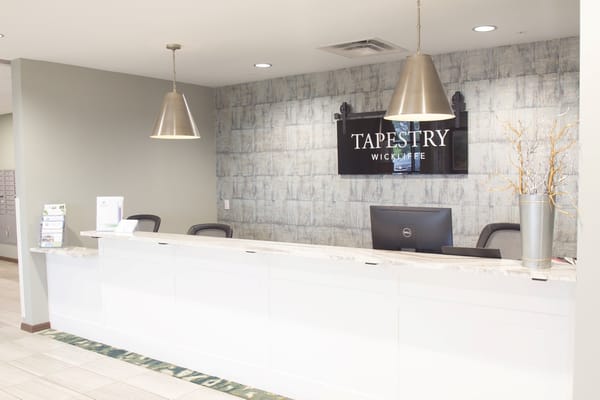 Reception area with a modern design and Tapestry logo