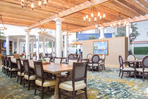 Bright dining area with wooden beams and elegant seating