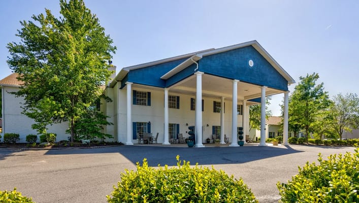 Exterior view of a senior living facility with columns