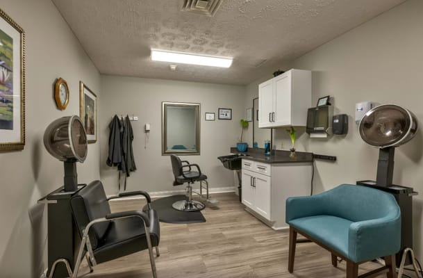 Beauty salon area with styling chairs and equipment
