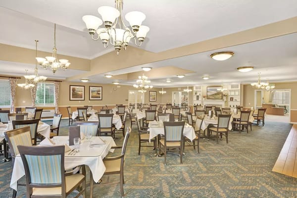 Spacious dining room with tables set for dining