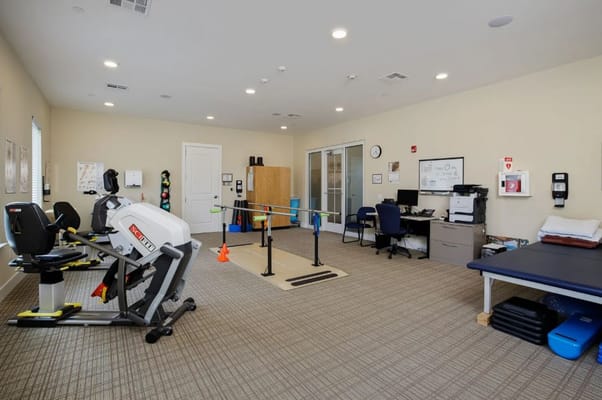 Interior view of a therapy room with equipment