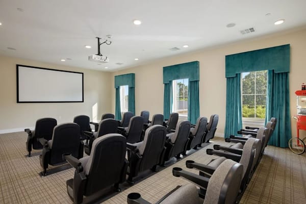 Interior of a theater room with seating and projector