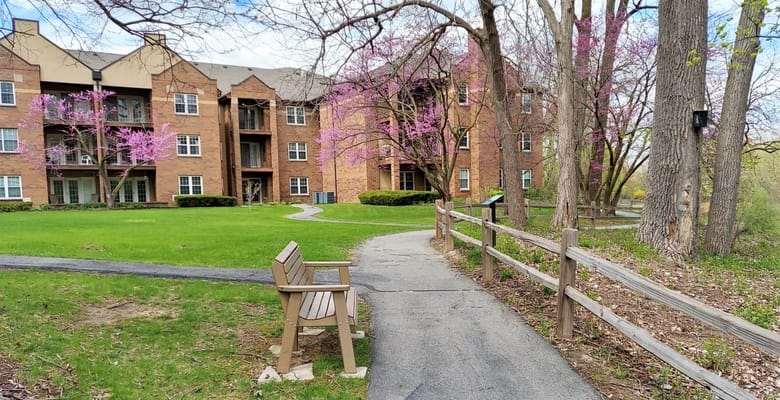 Outdoor walkway with seating near the building
