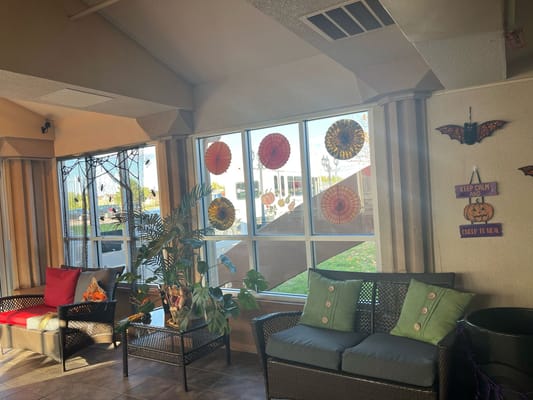 Common area with Halloween decorations and seating