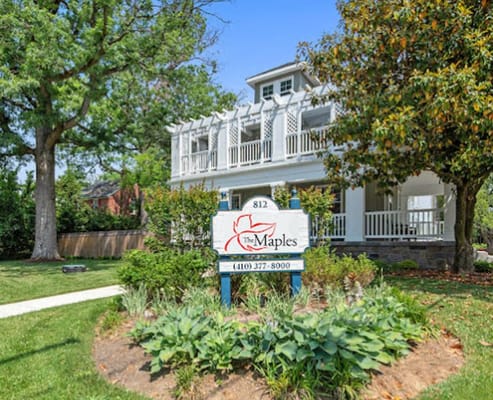 Exterior view of The Maples at Stoneleigh with gardens