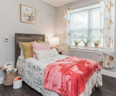 Cozy interior bedroom setup with floral decor