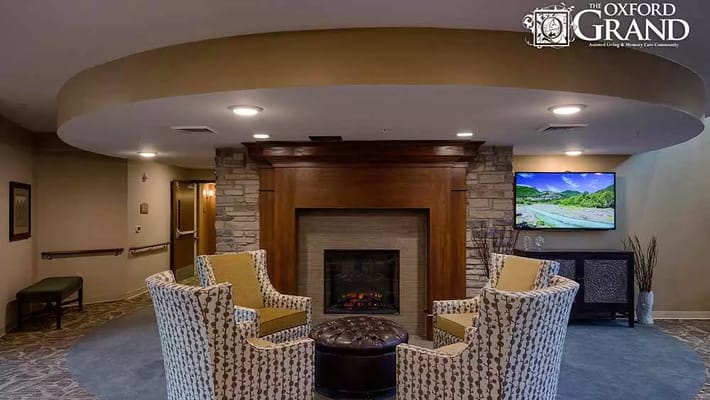 Comfortable seating area with a fireplace in the lobby