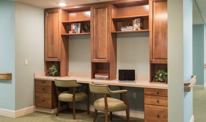 Office area with a desk and two chairs