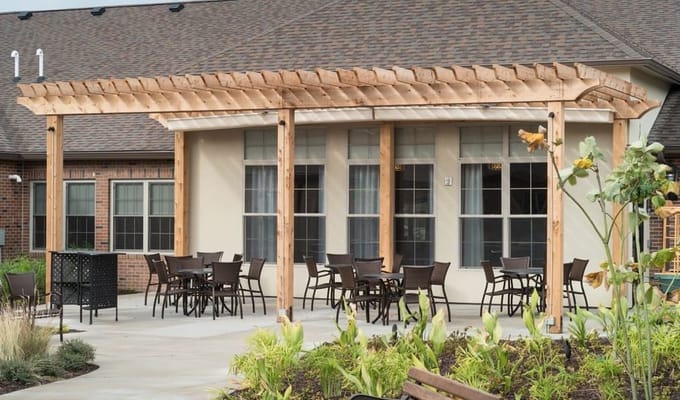 Covered outdoor patio with seating at The Pearl at Jamestown