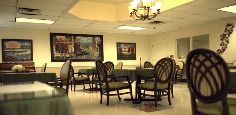 Spacious dining room with tables and chairs set up