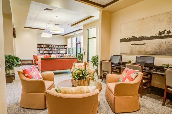 Cozy library lounge with seating and bookshelves